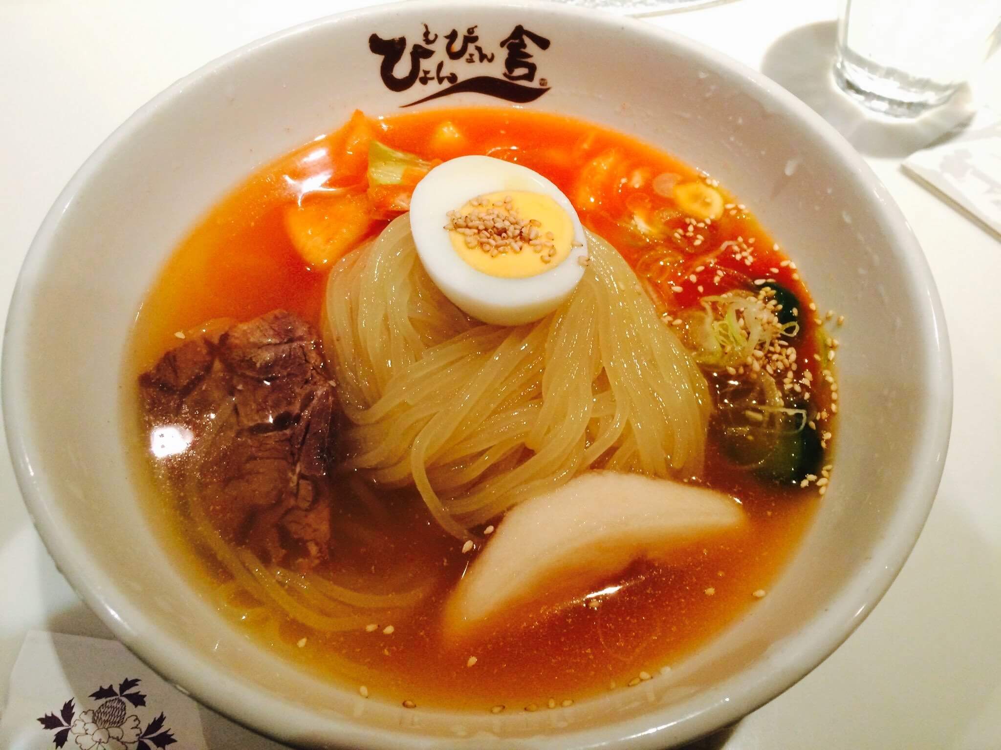 Morioka reimen cold noodles with kimchi in chilled beef broth