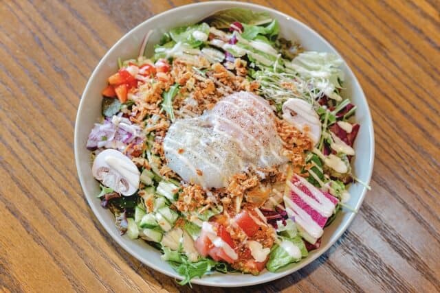 taco rice in bowl with dressing