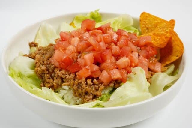 taco rice with tomatoes on top