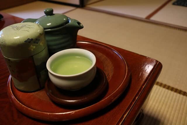 green tea with porcelain teapot
