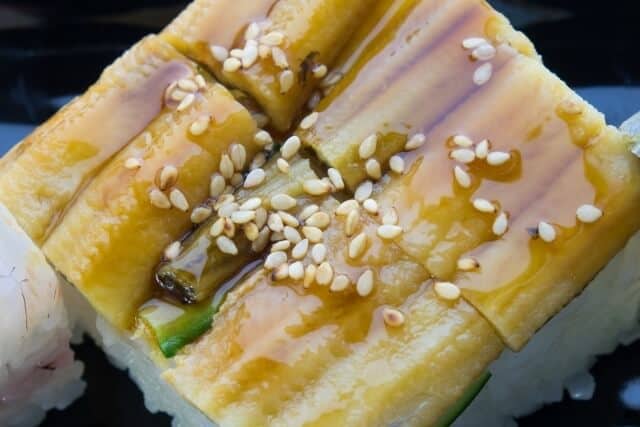 Anago zushi with sesame seeds on top
