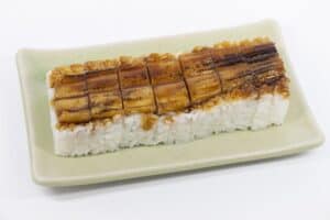 Anago zushi with white background and plate