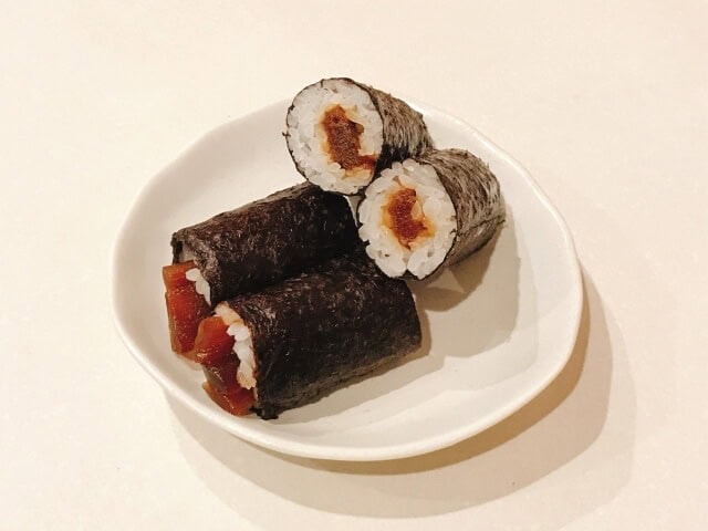 Kanpyo maki on a white plate