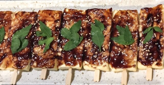 Tofu dengaku with sesame seeds and leaves on top