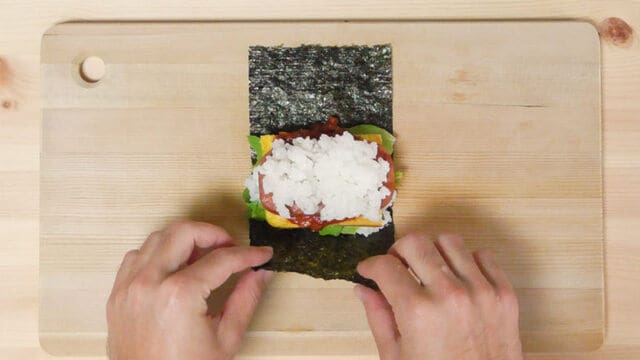 pork tamago onigiri being made