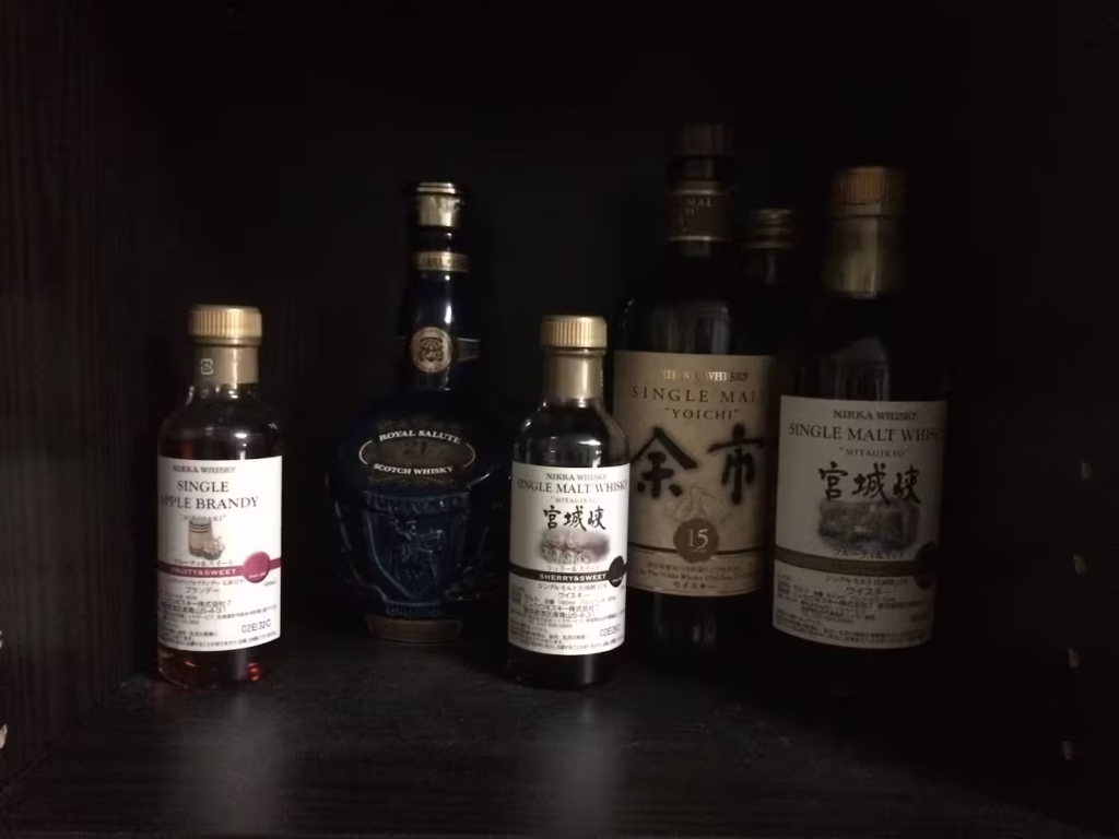 A cabinet filled with bottles of liquor