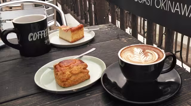 Capuchino with cakes at coffee shop