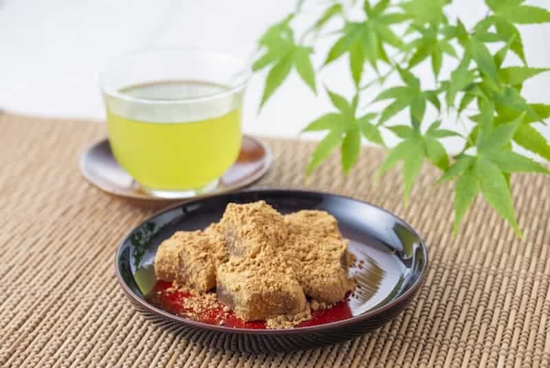 Sweet sesame matcha ice cream with green tea in a glass, Japanese dessert with traditional flavors.