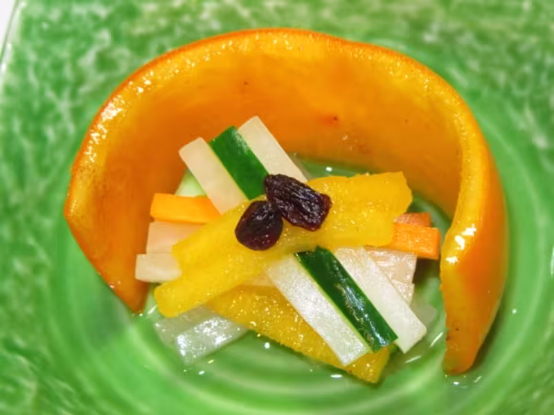 kaki namasu close up photo on a green ceramic plate