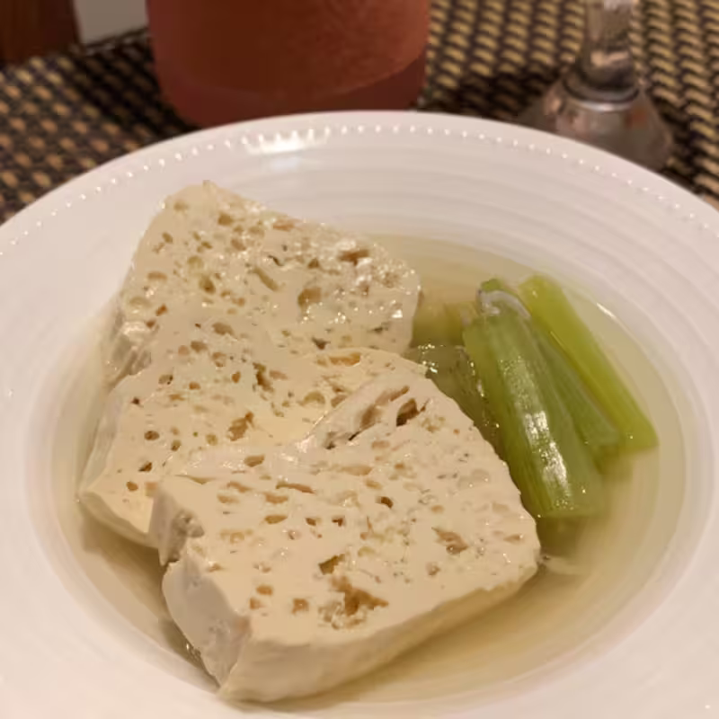 komo tofu soaked in white plate