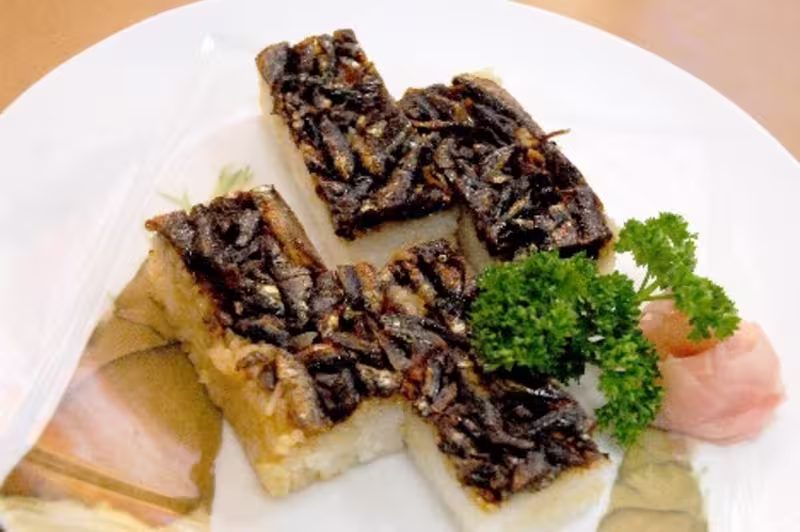 moroko sushi with garnish at side