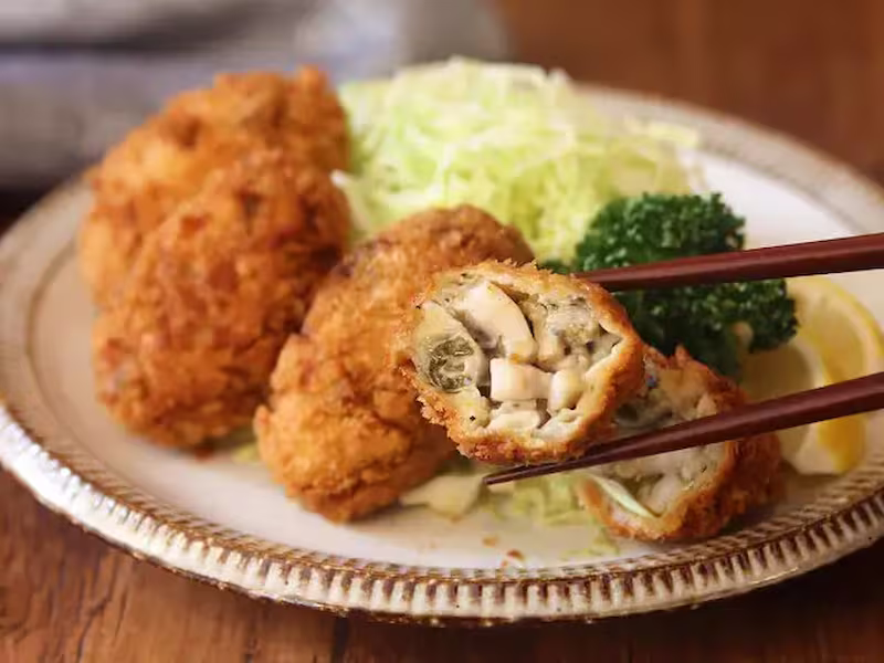 Kaki Fry filling with chopsticks