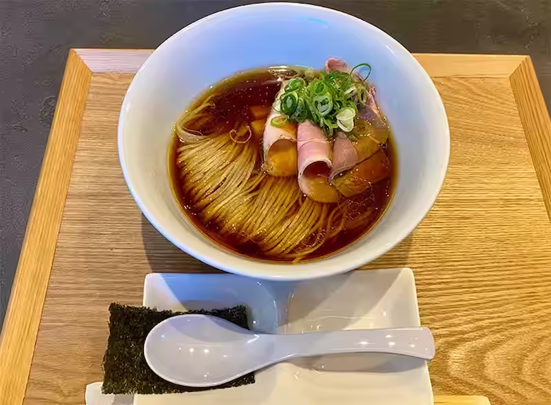 Shina Soba on wooden saucer with spoon