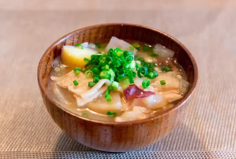 Otsuke Dango soup with wheat dumplings, vegetables, and miso broth in Yamanashi