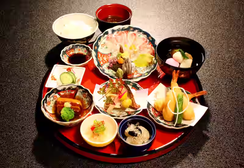 Traditional Shippoku Ryori dishes on dark background