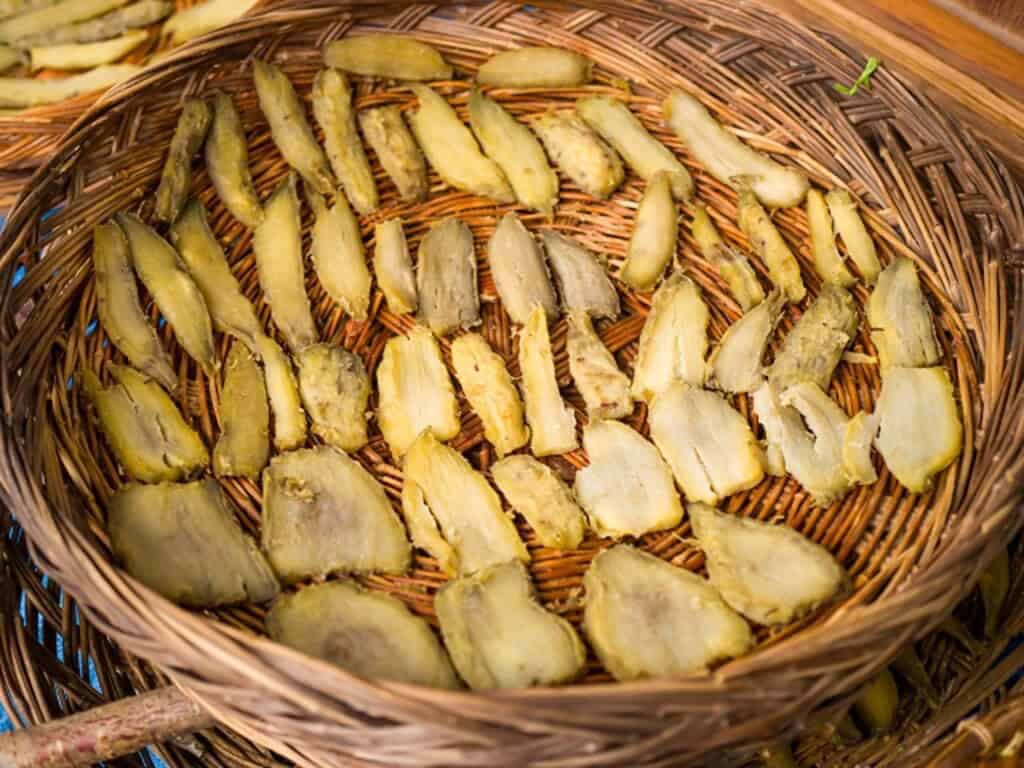 Dried sweet potato slices (Hoshiimo) displayed on a traditional bamboo basket in Japan.