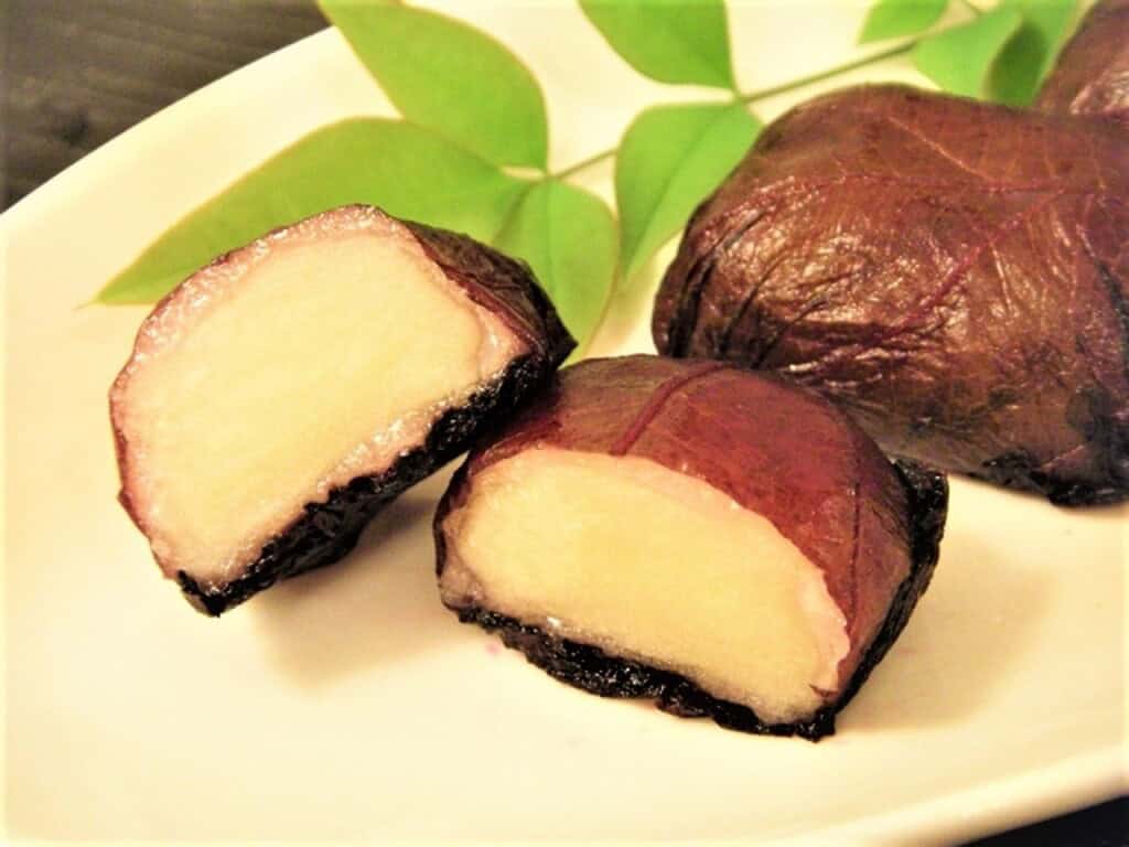 Traditional Japanese plum mochi from Mito no Ume, featuring sweet, chewy rice cake with ume fruit fl.