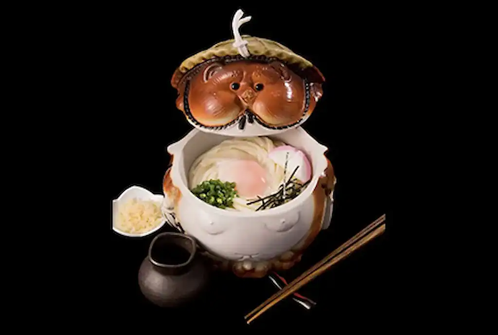 Traditional Tatebayashi udon served in a decorative bowl with toppings and condiments.