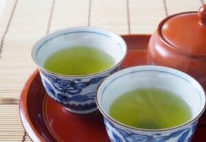 Fukamushi Sencha (深蒸し煎茶) Traditional Japanese Fukamushi Sencha green tea in blue and white porcelain cups.