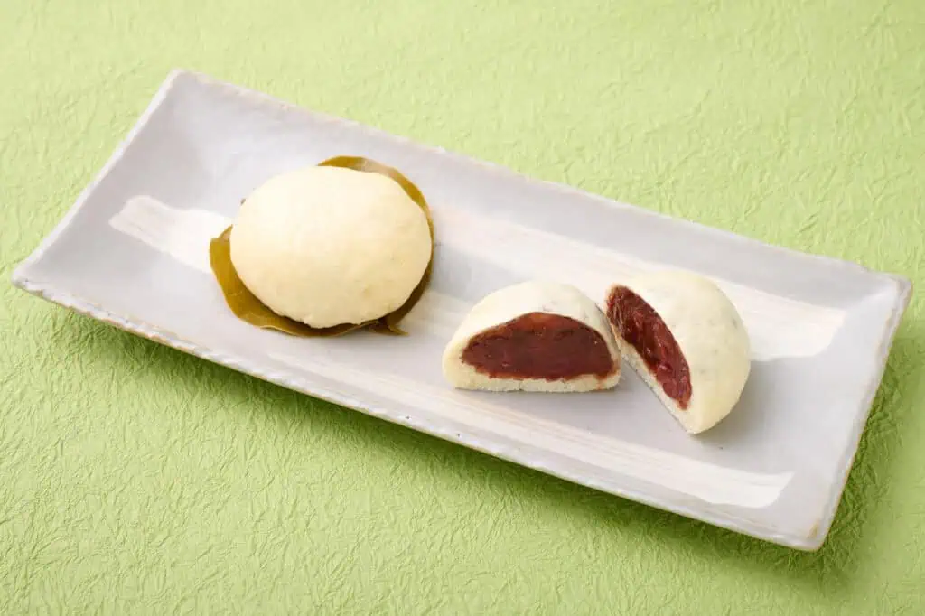 Traditional Barappa Manju with red bean filling on a white plate.