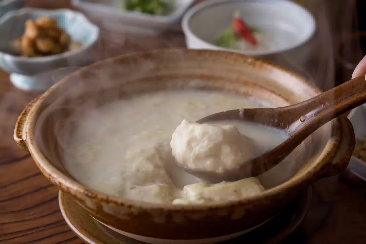 Ureshino Onsen Yudofu, tofu simmering in a milky broth in a clay pot